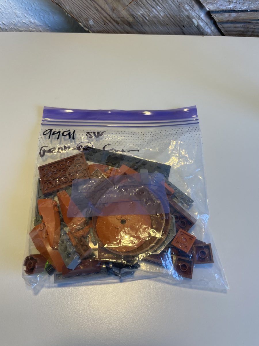 A sealed bag of brown and grey LEGO parts labelled 9491 Geonosian Cannon